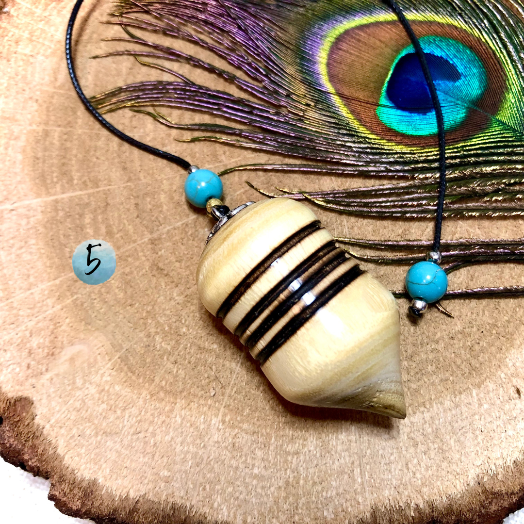 Beginner pendulums made of acacia wood and turquoise stones.